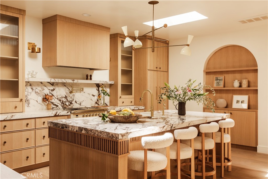 a kitchen with a table and chairs in it