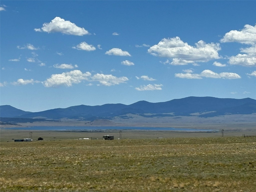 a view of an ocean and a mountain