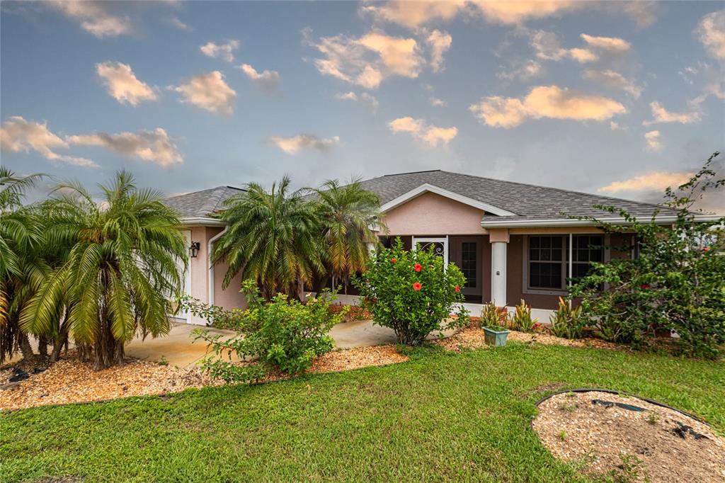 a front view of house with yard and outdoor seating