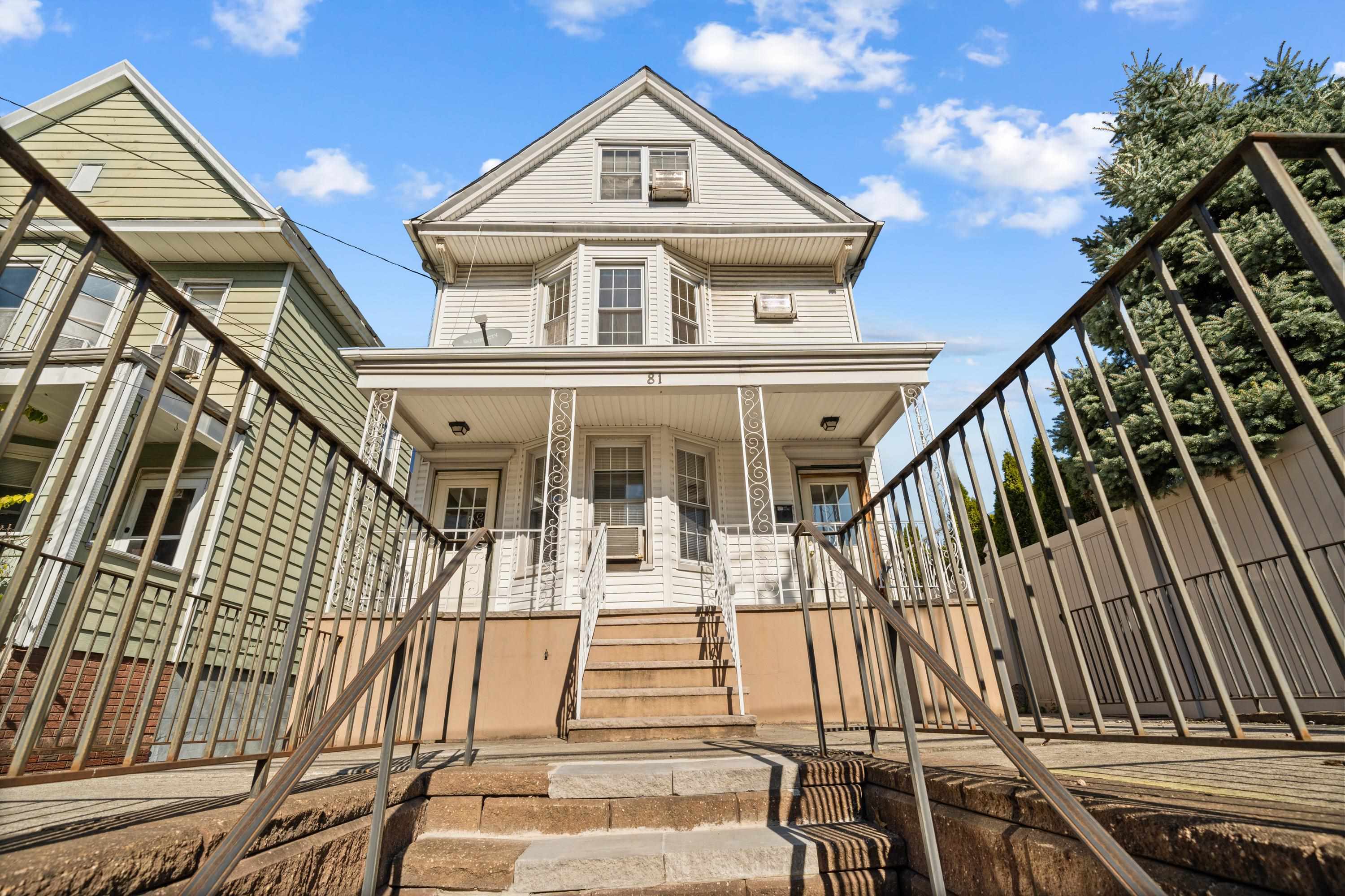 a view of a house with wooden stairs