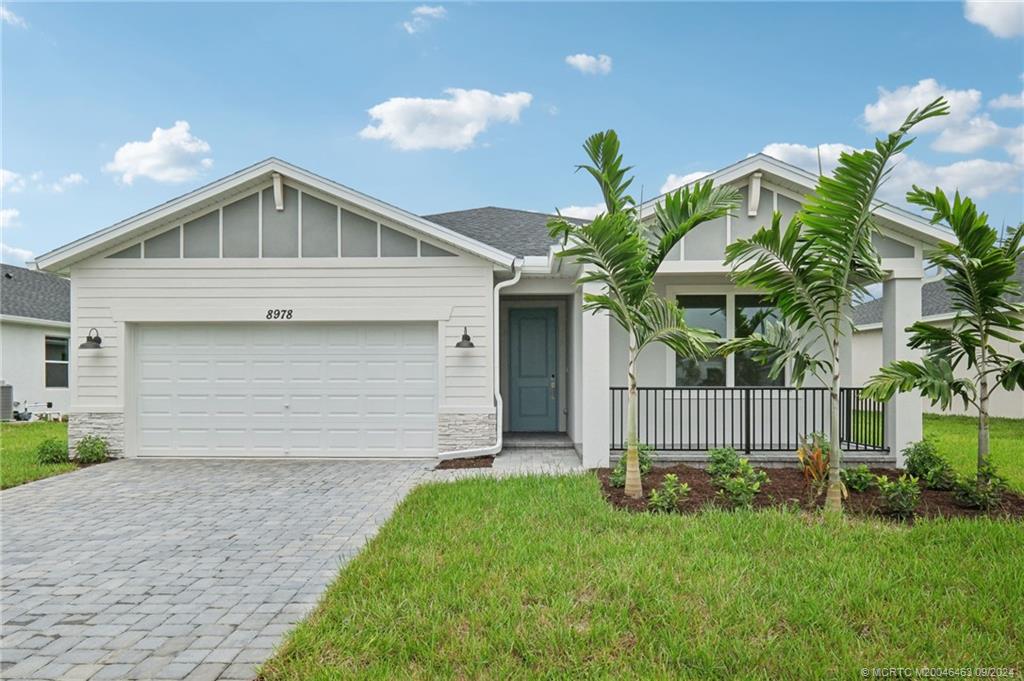 a front view of house with yard and seating