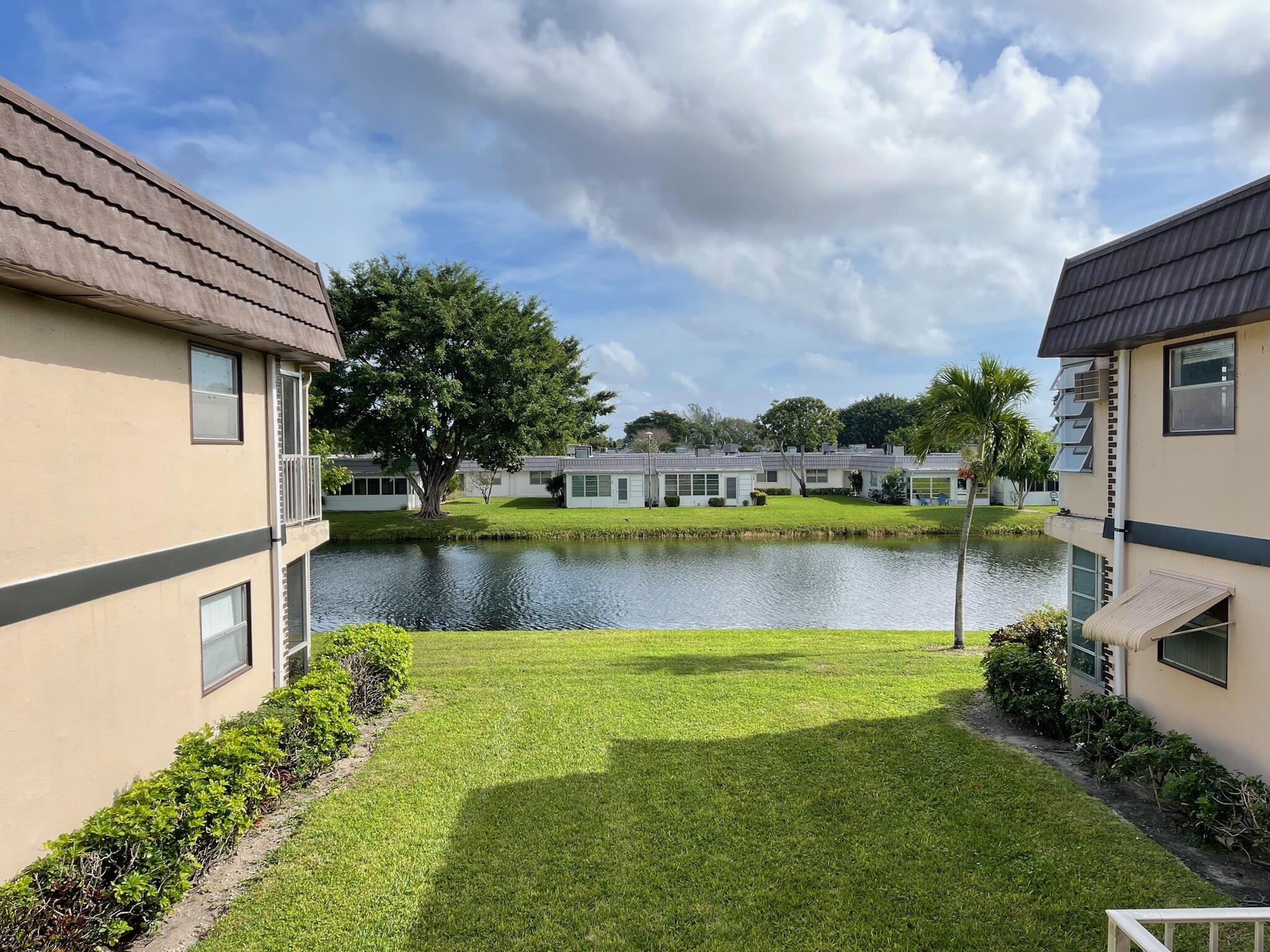 a view of a lake with a house in the background