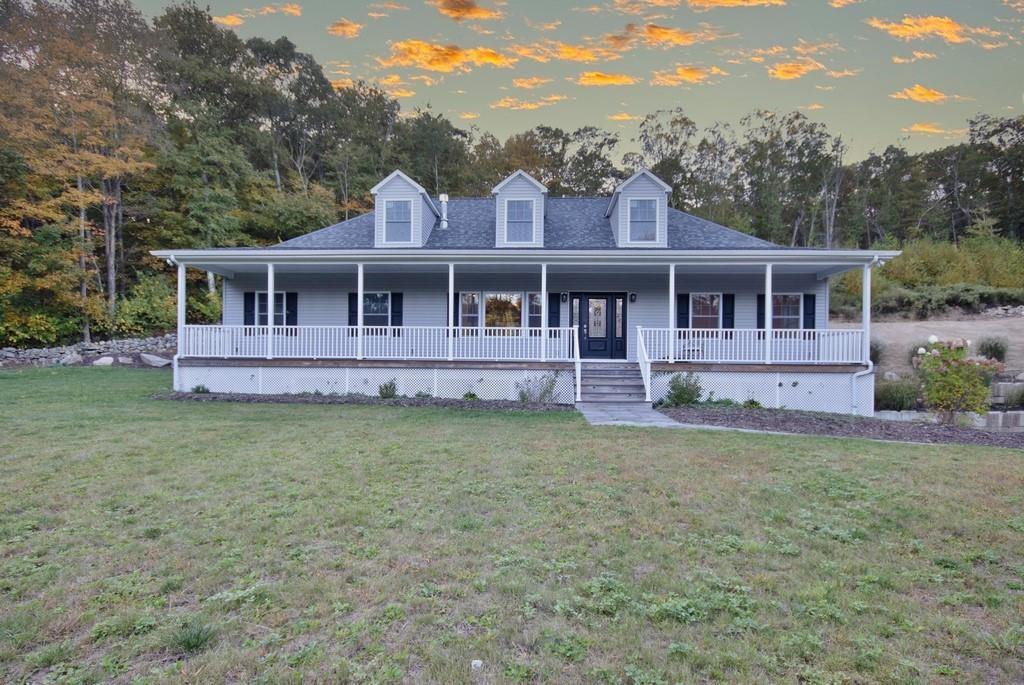 front view of a house with a yard