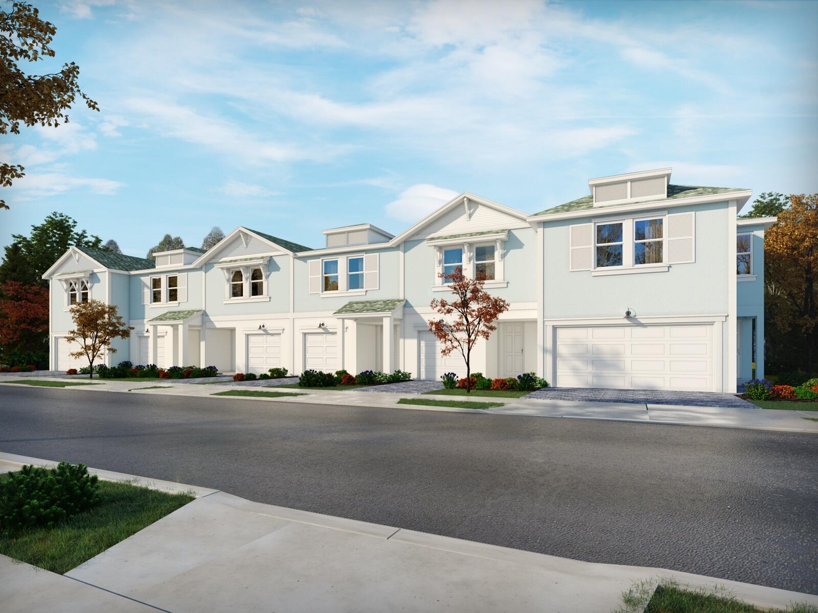 a front view of residential houses with street