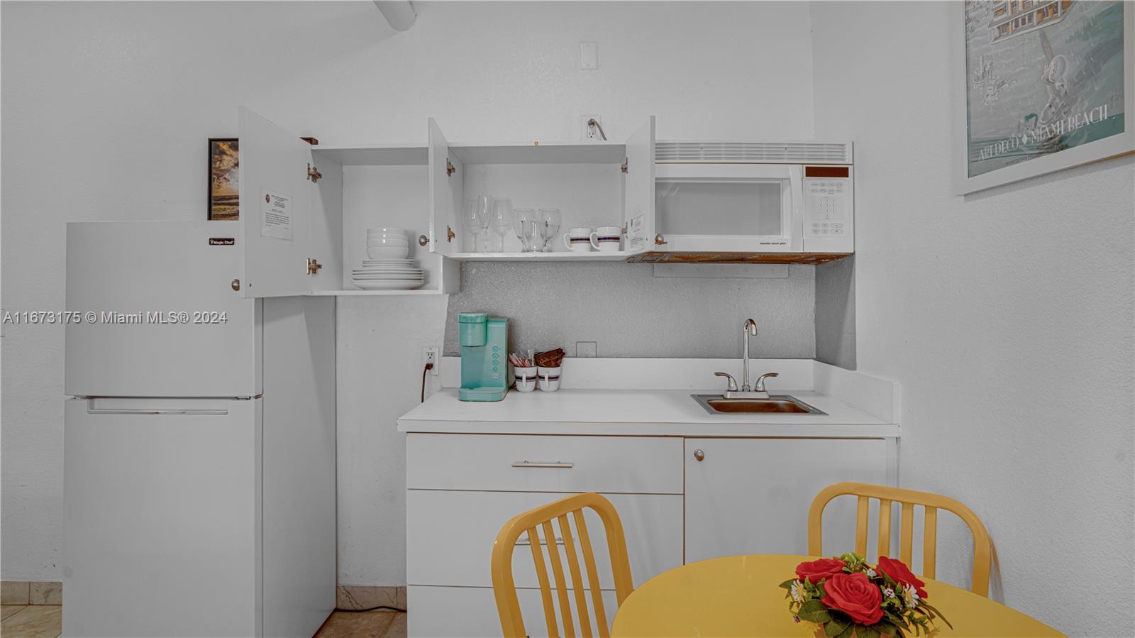 a kitchen with appliances cabinets and a sink