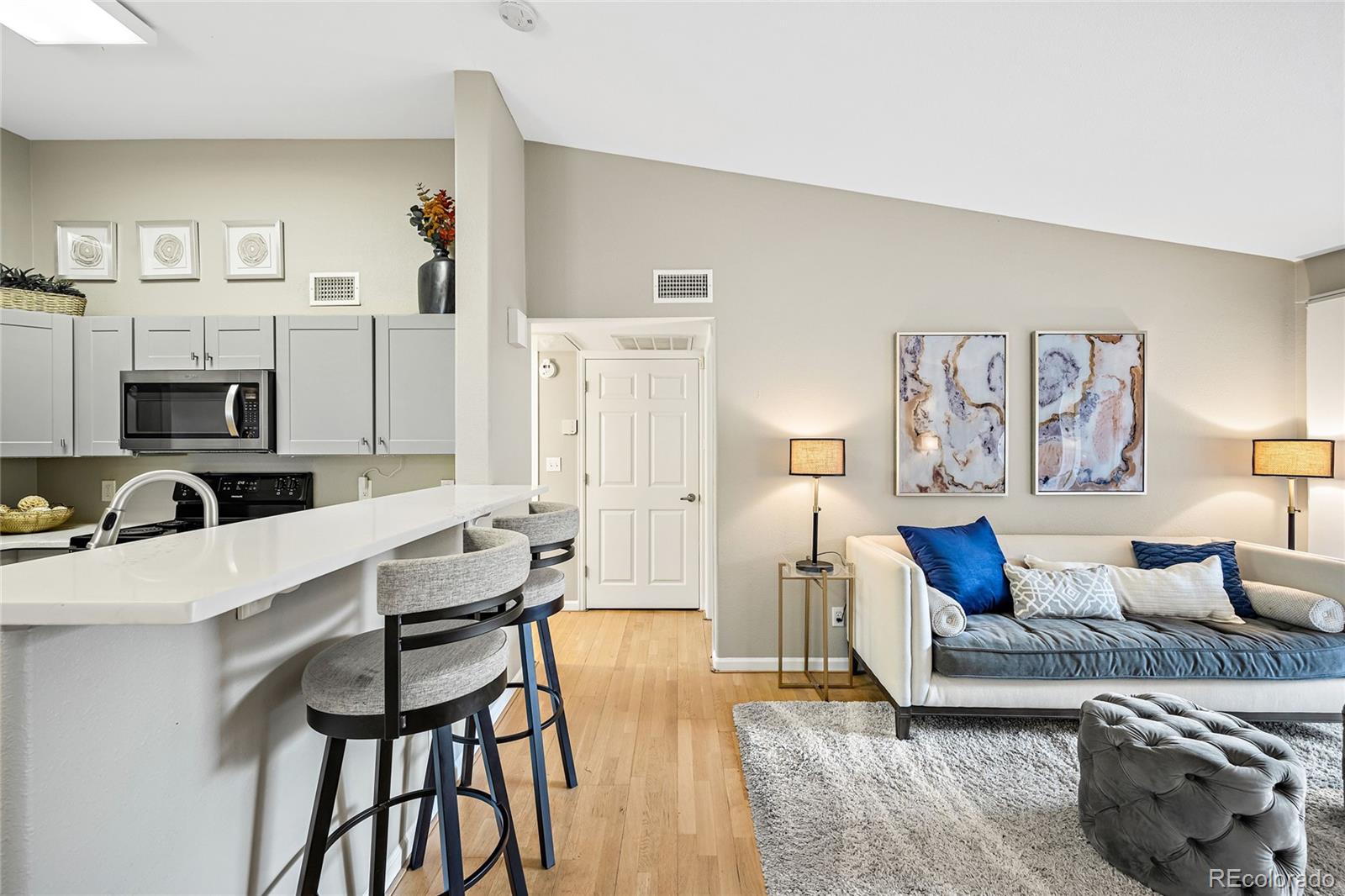 a living room with furniture a fireplace and a table