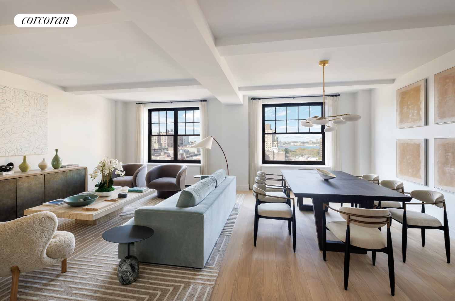 a living room with furniture wooden floor and a window