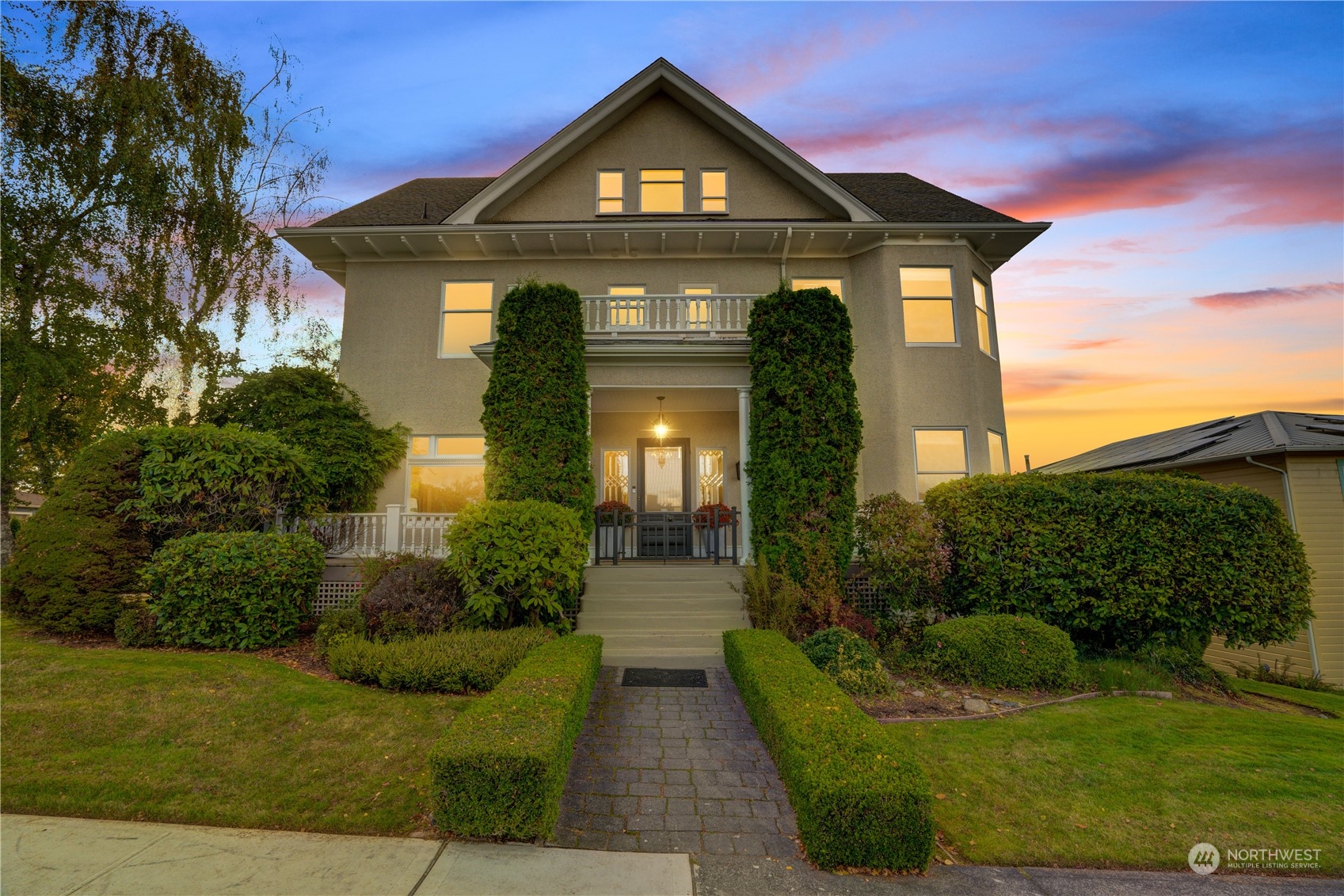 a front view of a house with garden