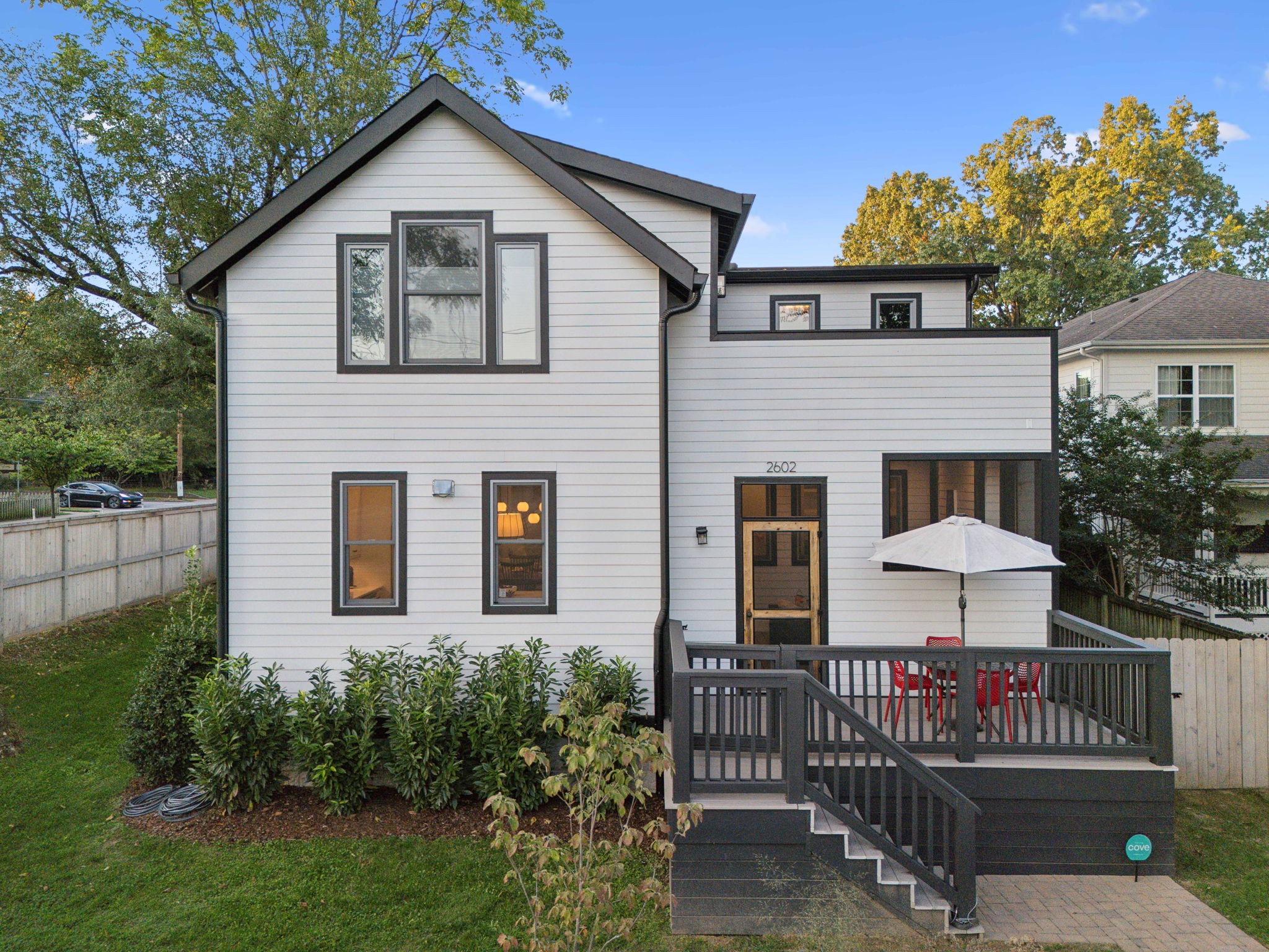 Built in 2020, the home is inspired by period architecture. You'll enjoy 10' ceilings, sun lit rooms. large windows, designer lighting, beautiful trim, doors, and hardwoods throughout.