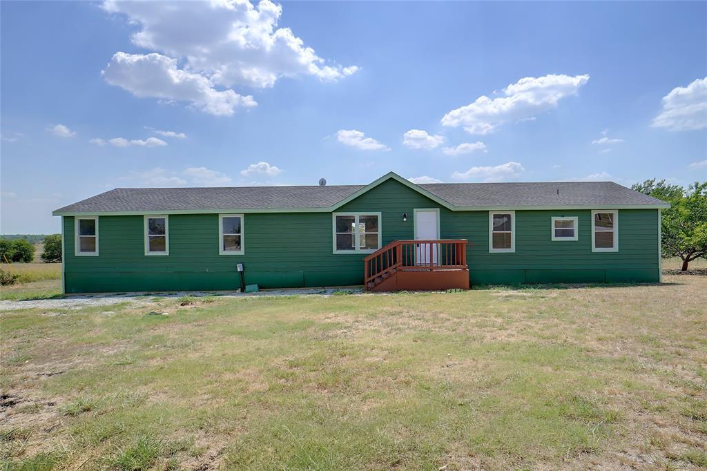 a front view of a house with yard