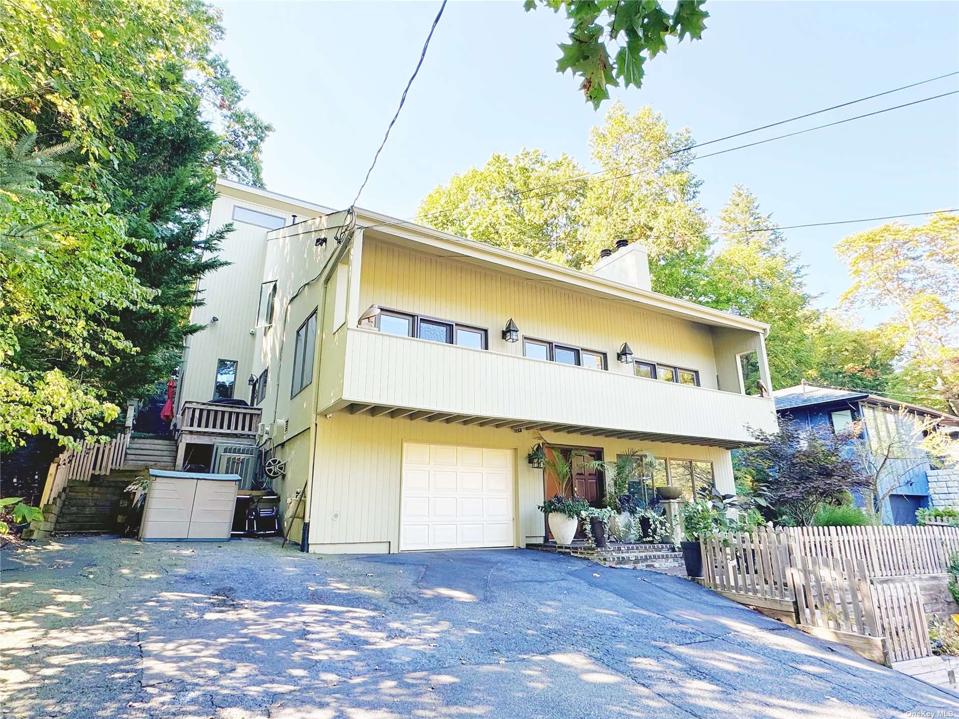 a view of a building with a patio and a garage