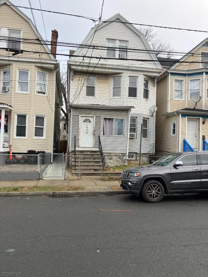 a car parked in front of a house