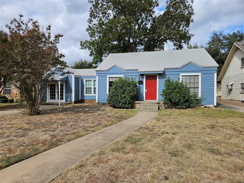 front view of a house with a yard