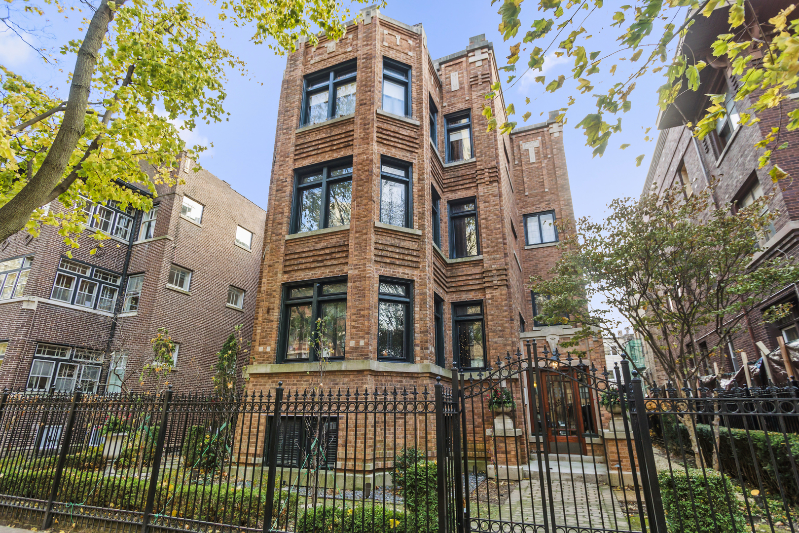 front view of a brick house with a large windows