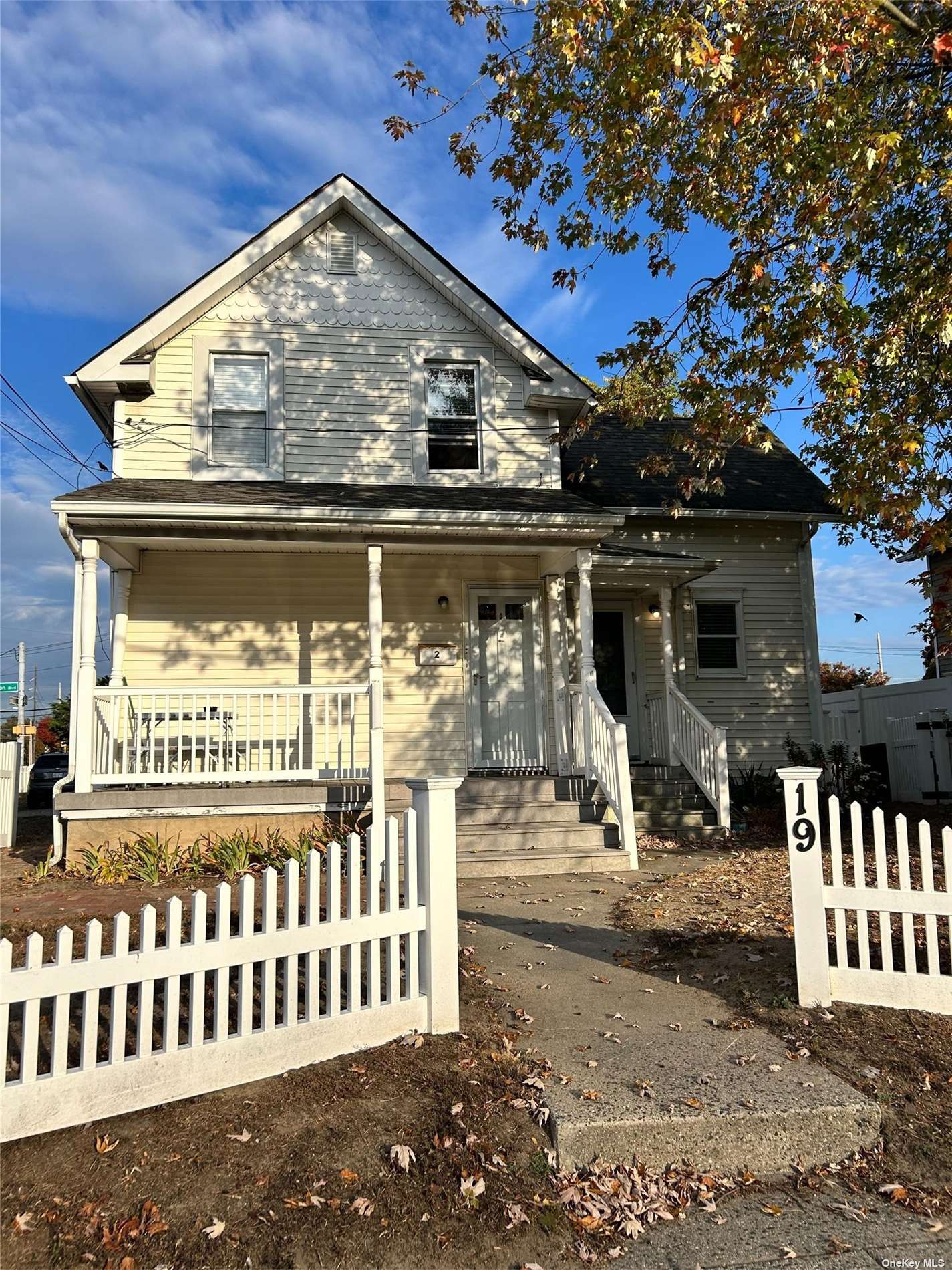 a view of a house with wooden fence