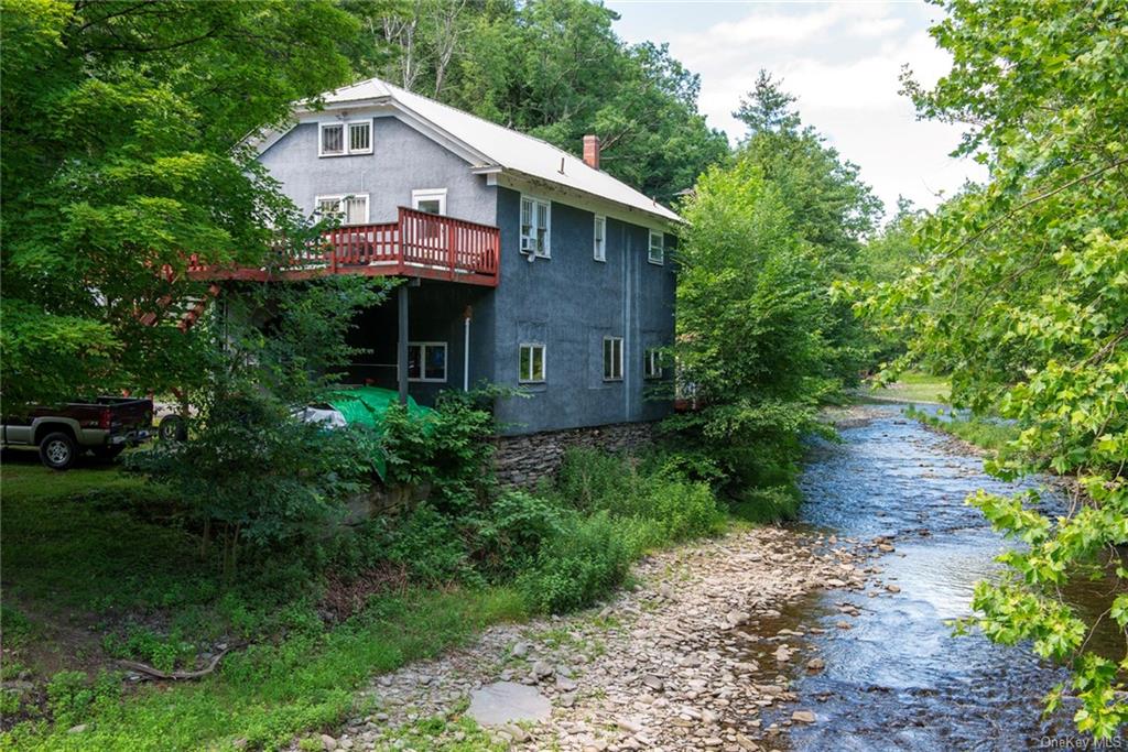 Back of house featuring a water view or Callicoon Creek