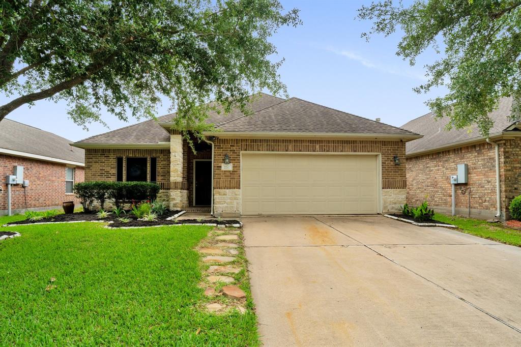 a front view of a house with a yard and porch