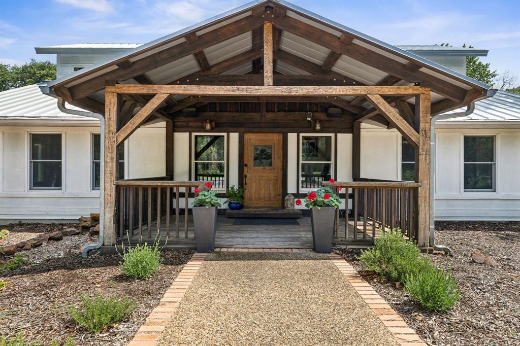 a view of a house with wooden deck