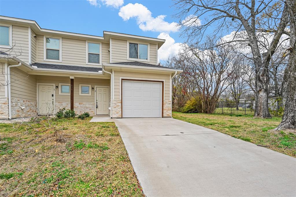 front view of a house with a yard