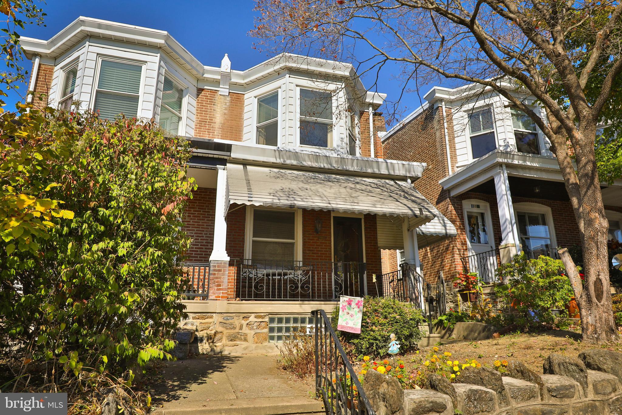 a view of a brick house with large windows