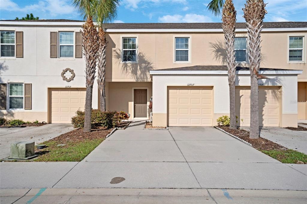 a front view of a house with yard