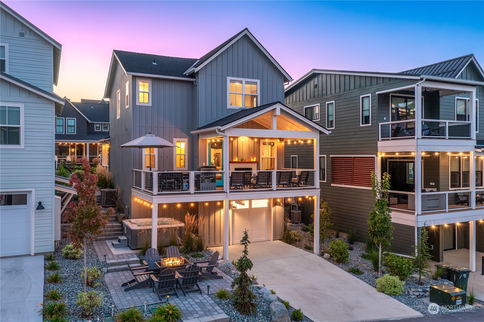 a front view of a house with a yard and balcony