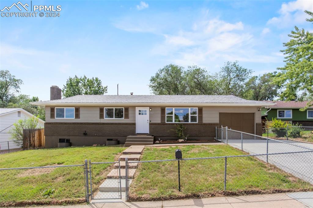 Ranch-style house with a front lawn