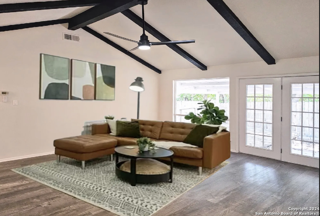 a living room with furniture and a large window