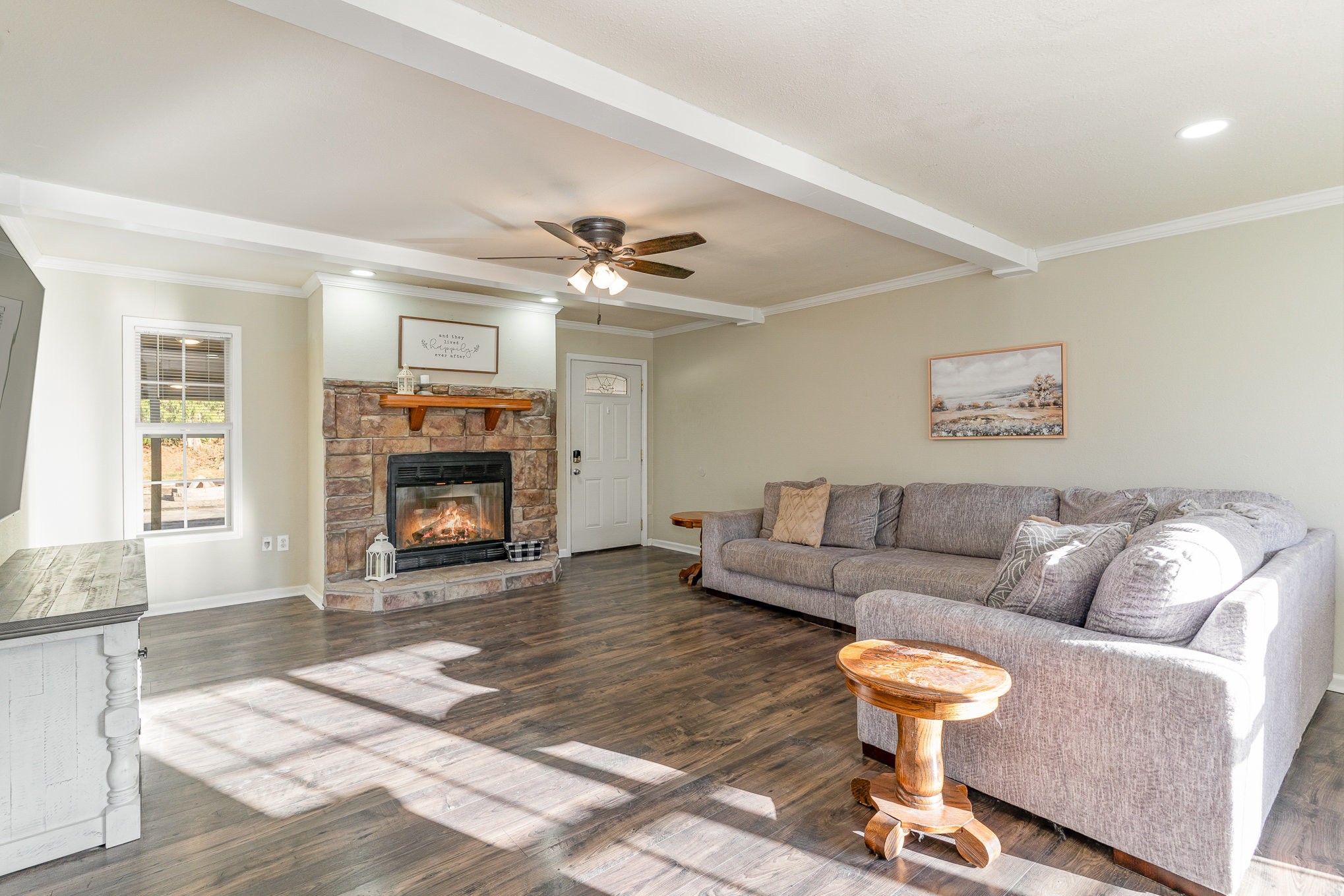 a living room with furniture and a fireplace