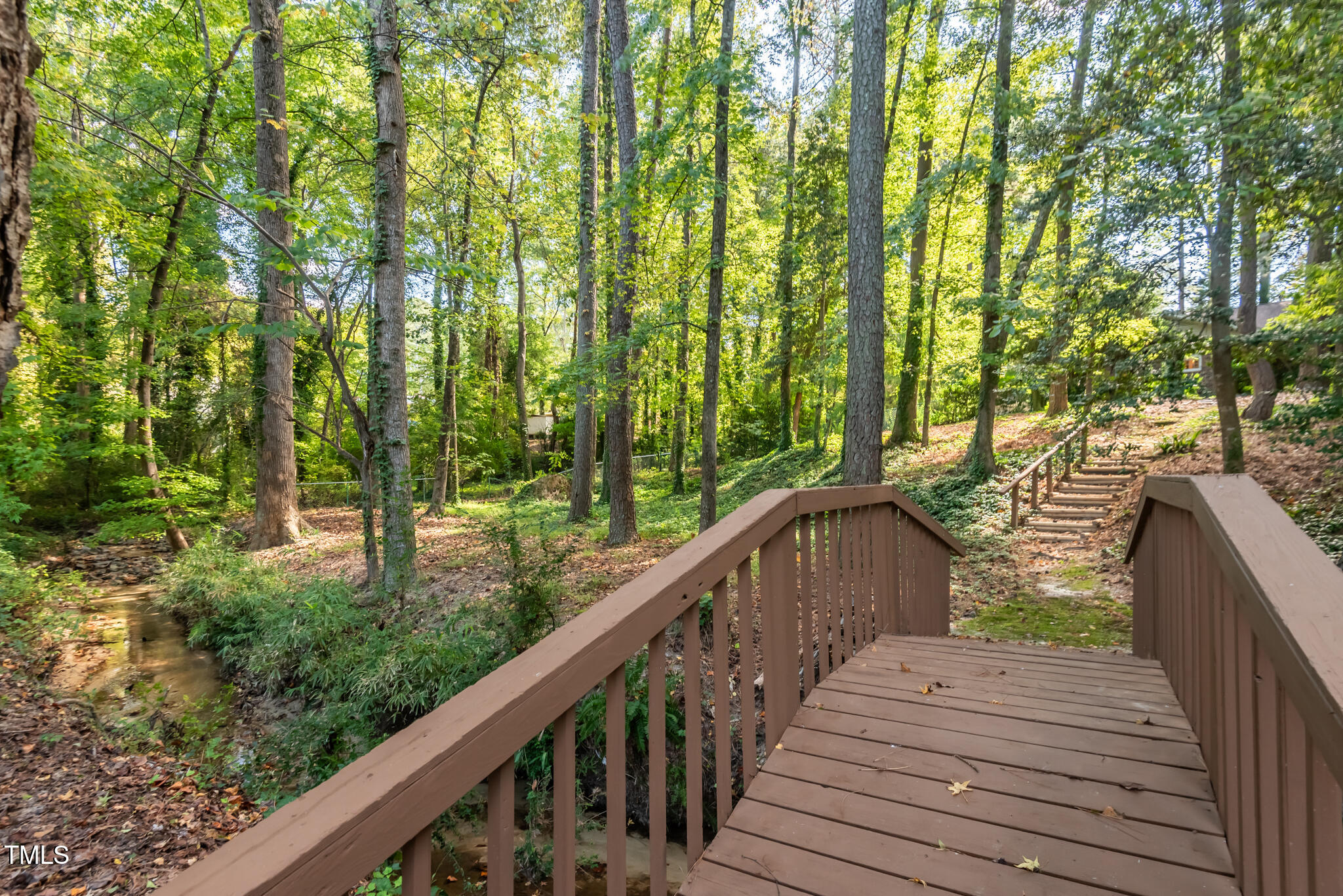 a balcony with trees in front of it