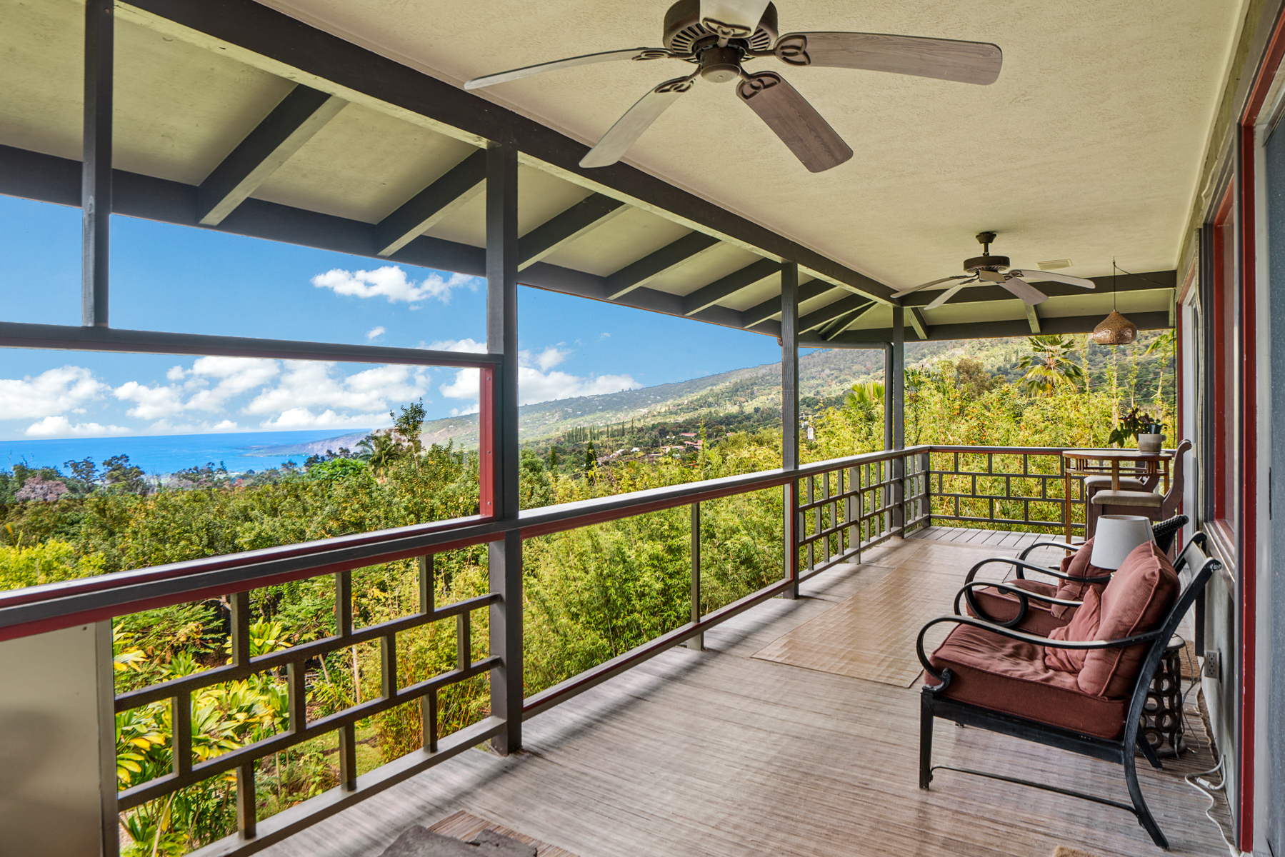 a view of a chairs and table in the balcony