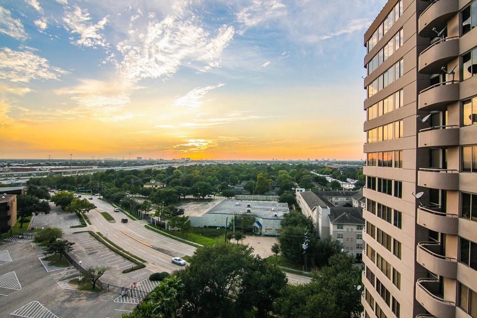 a view of city with tall buildings