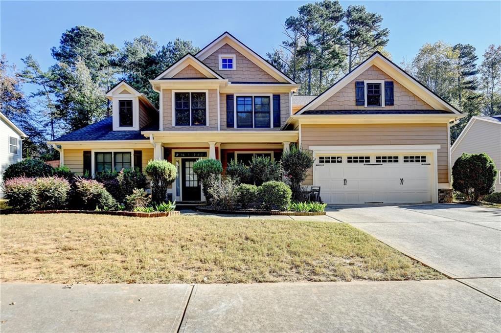 a front view of a house with a yard