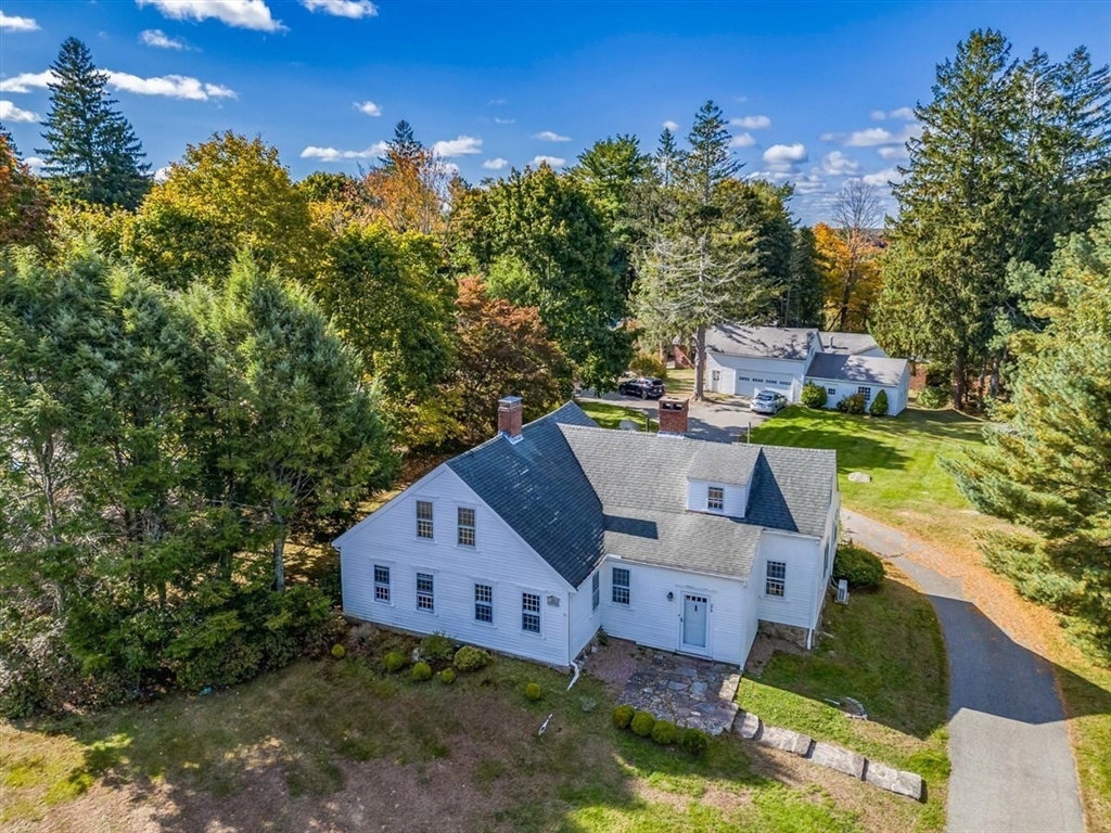 an aerial view of a house with a garden