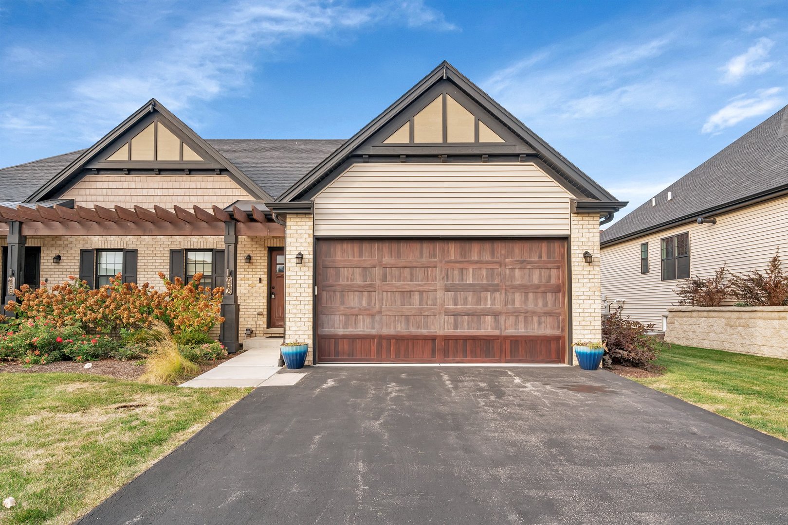 a front view of a house with a garage