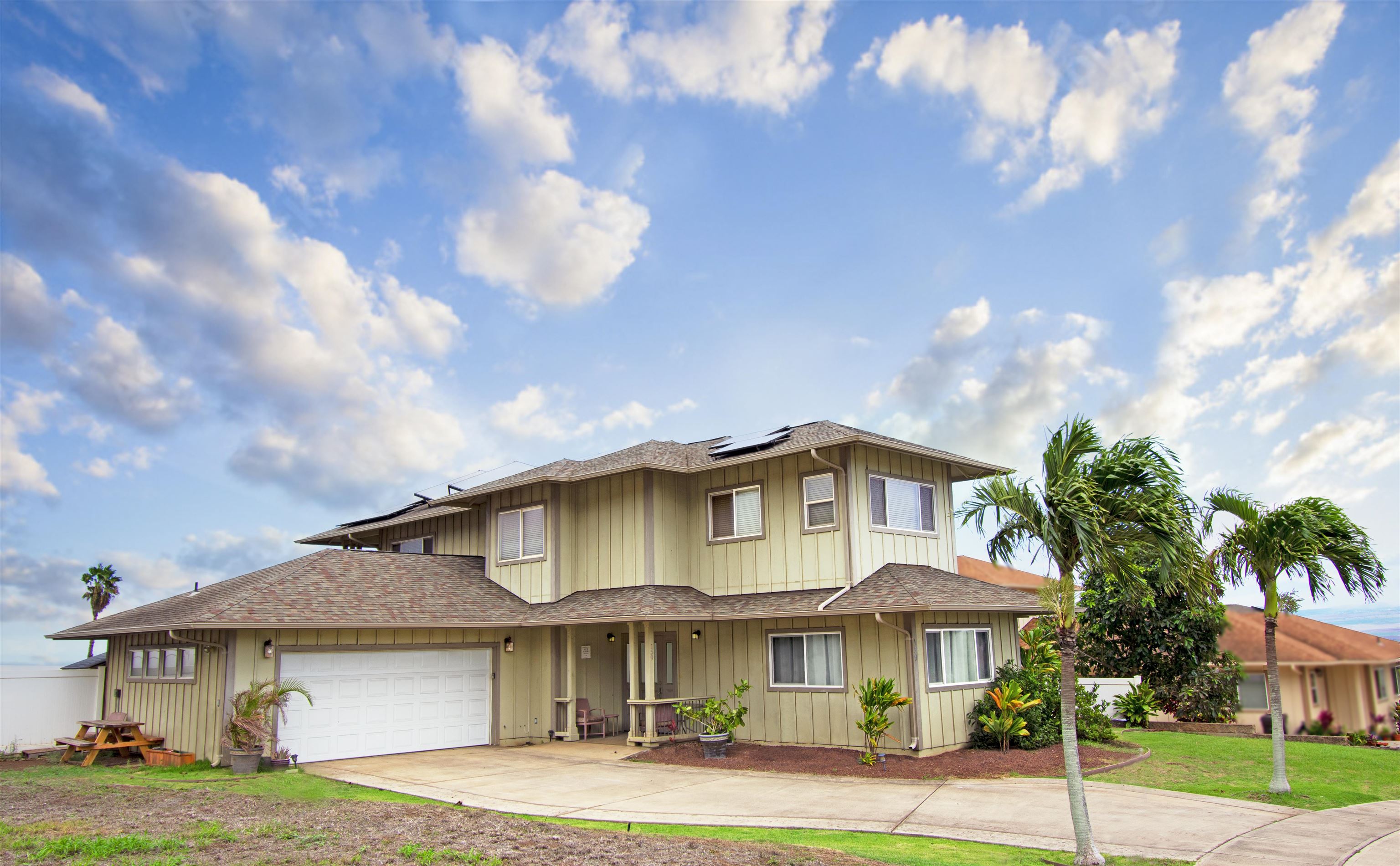 a front view of a house with garden