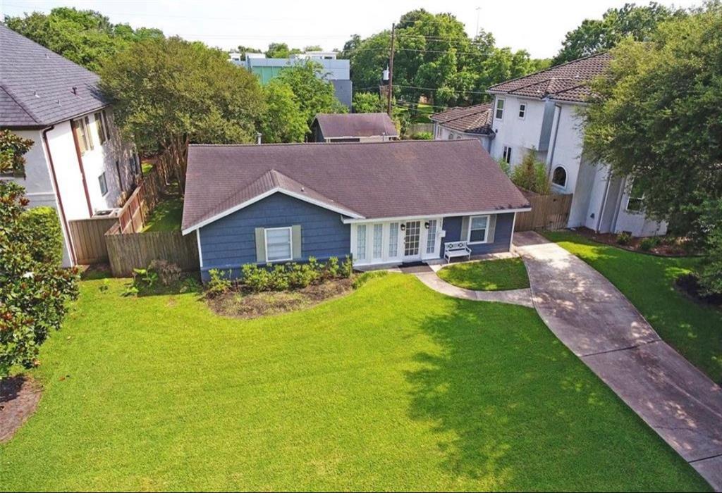 a view of a house with garden and yard