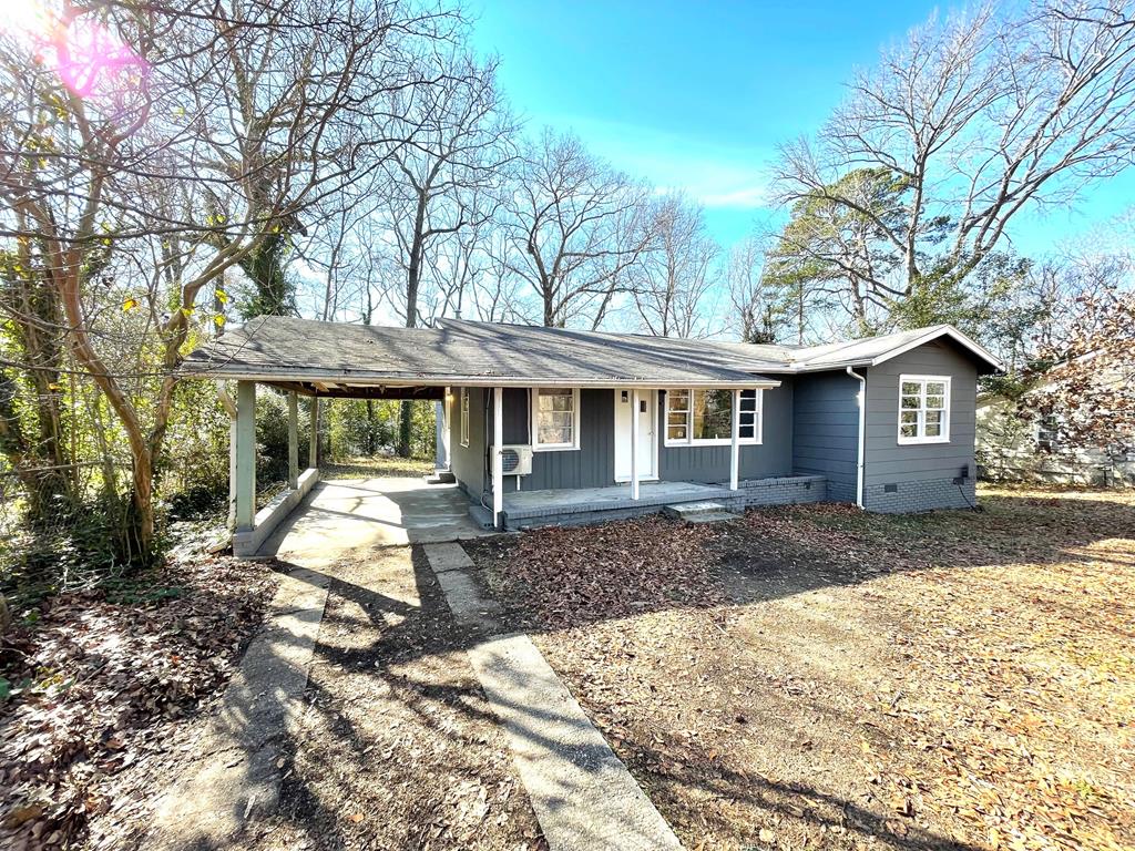 a front view of a house with a yard and porch