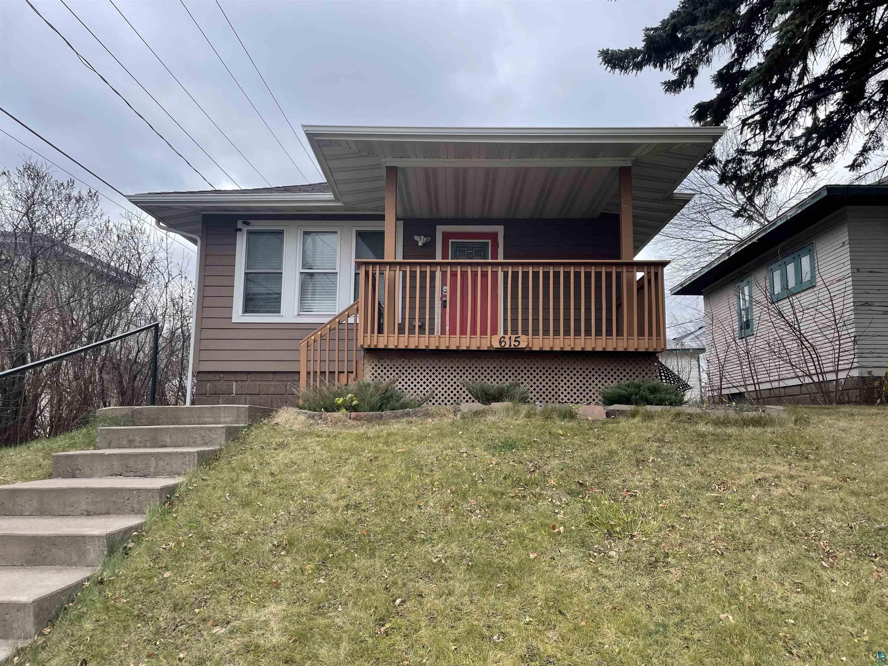 Bungalow-style house with a front yard