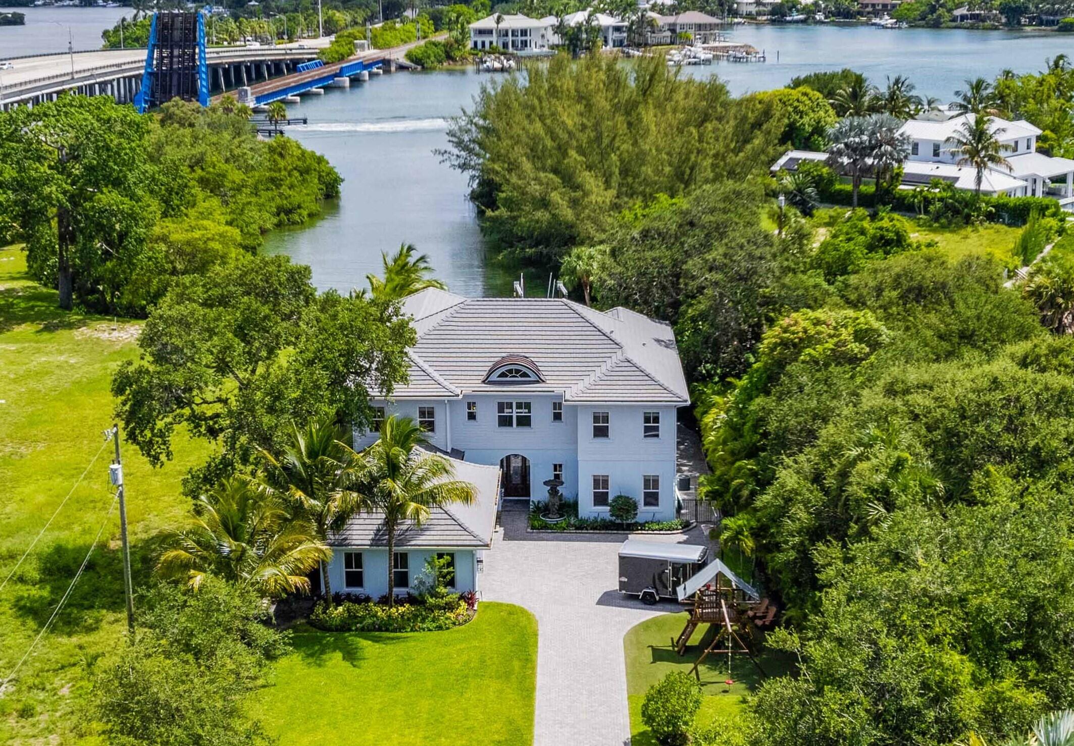 an aerial view of a house with swimming pool yard and outdoor seating