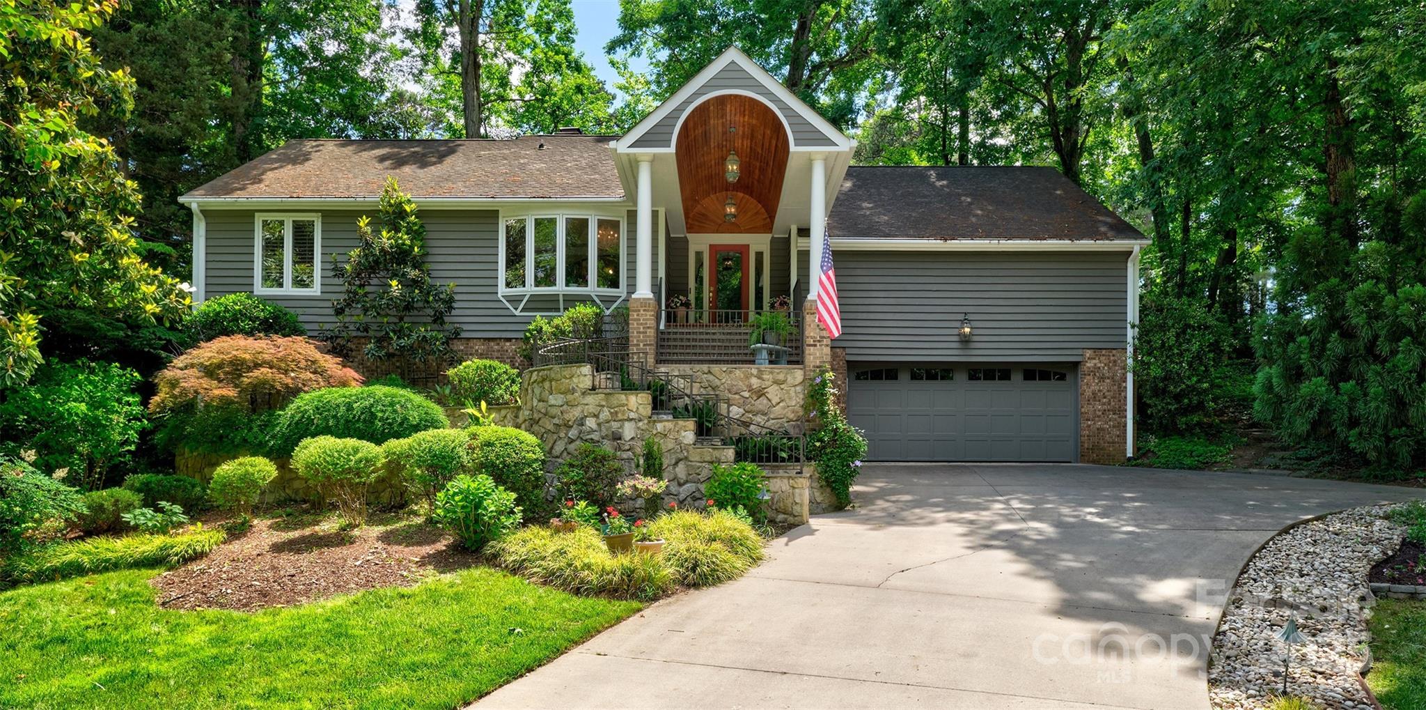 a front view of a house with garden