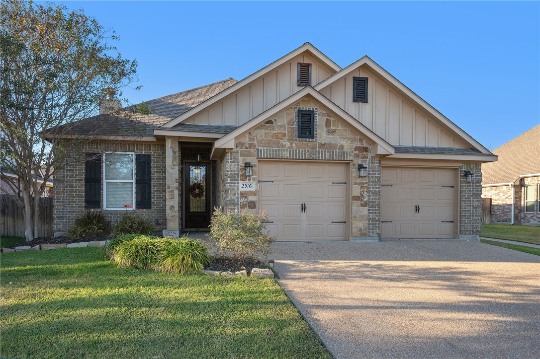 Craftsman-style house featuring a garage and a fro