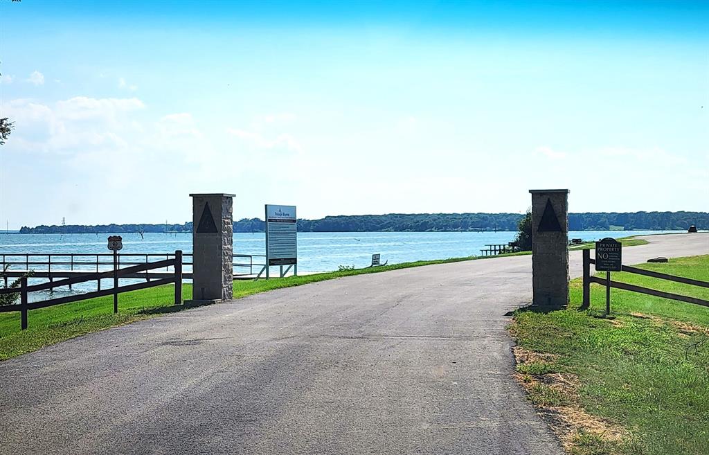 a view of a road with a building in the background