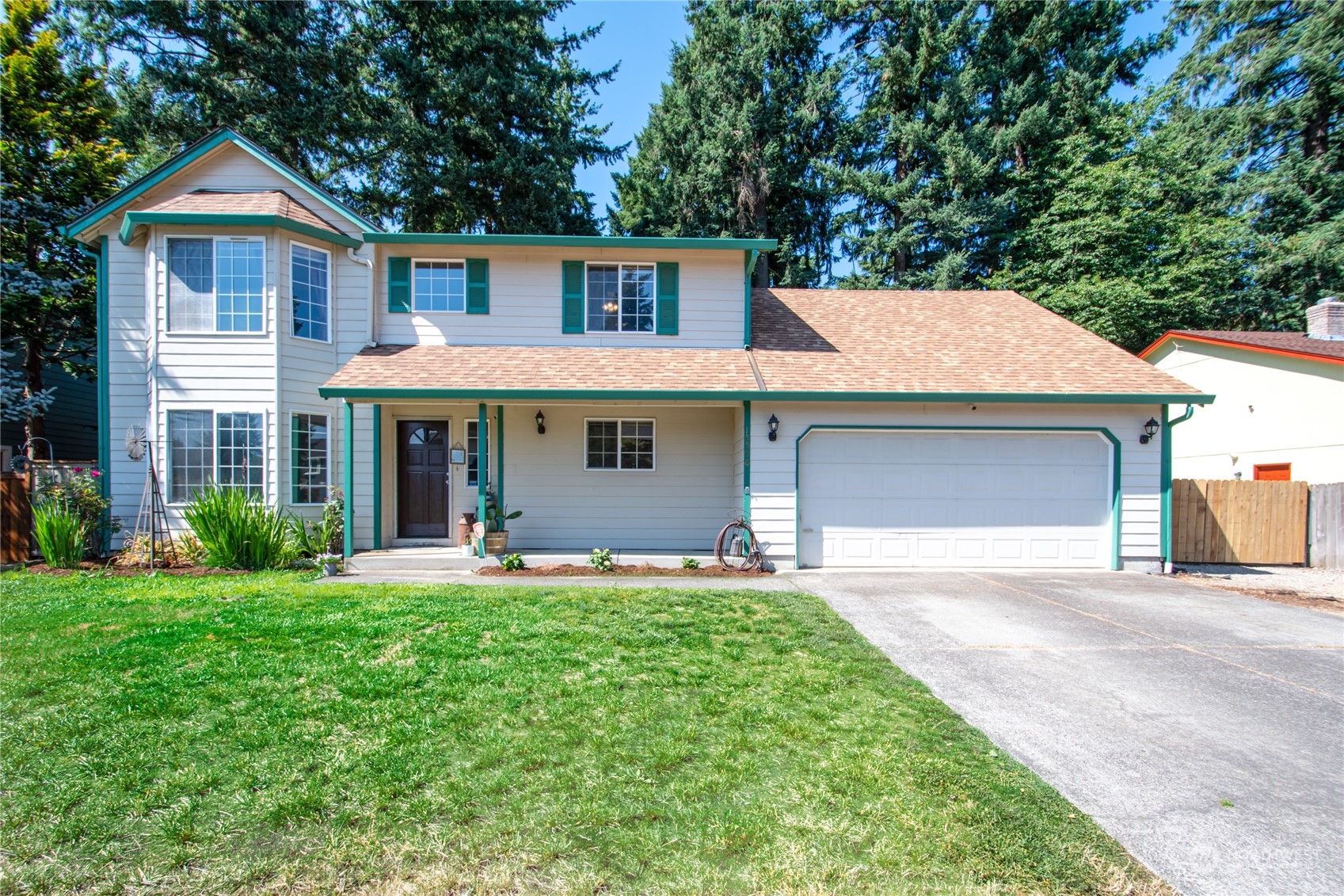 front view of a house with a yard