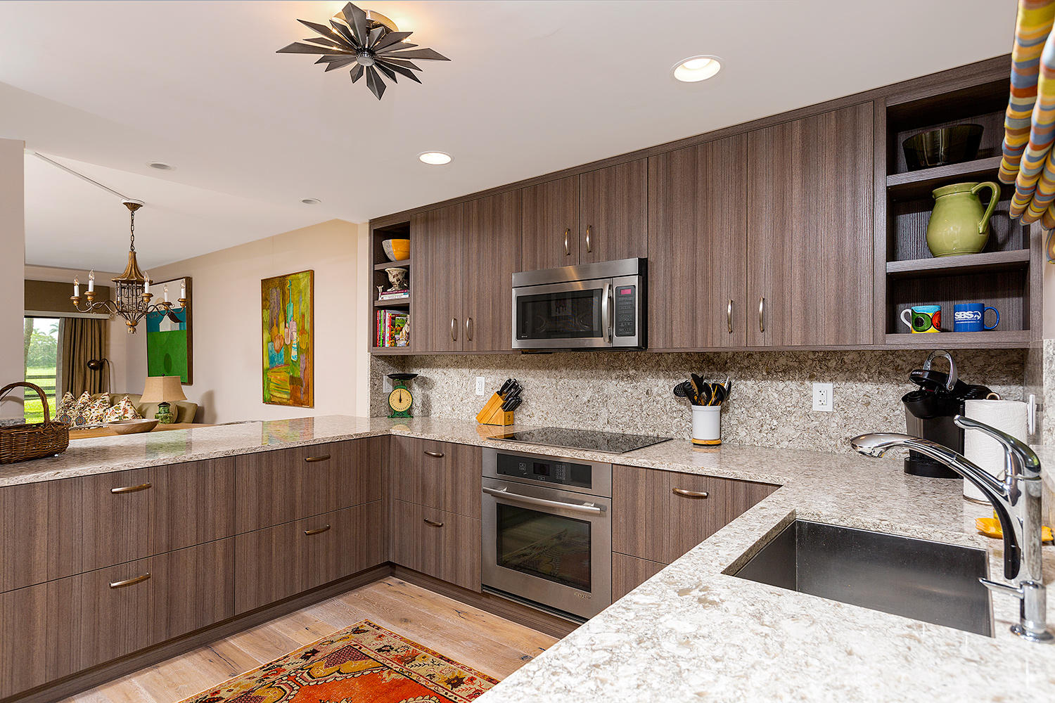 a kitchen with a sink appliances and cabinets