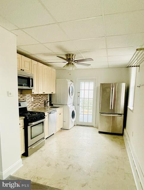 a kitchen with refrigerator and cabinets