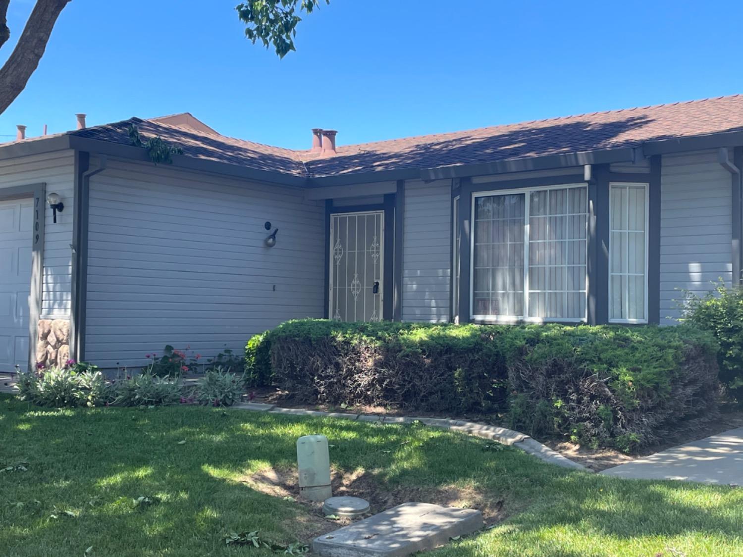 a view of a house with a yard