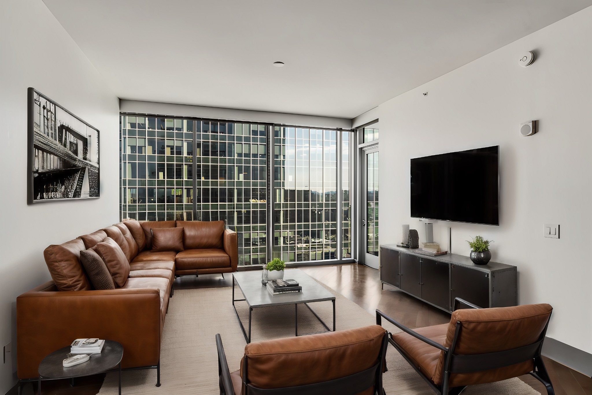 a living room with furniture and a flat screen tv