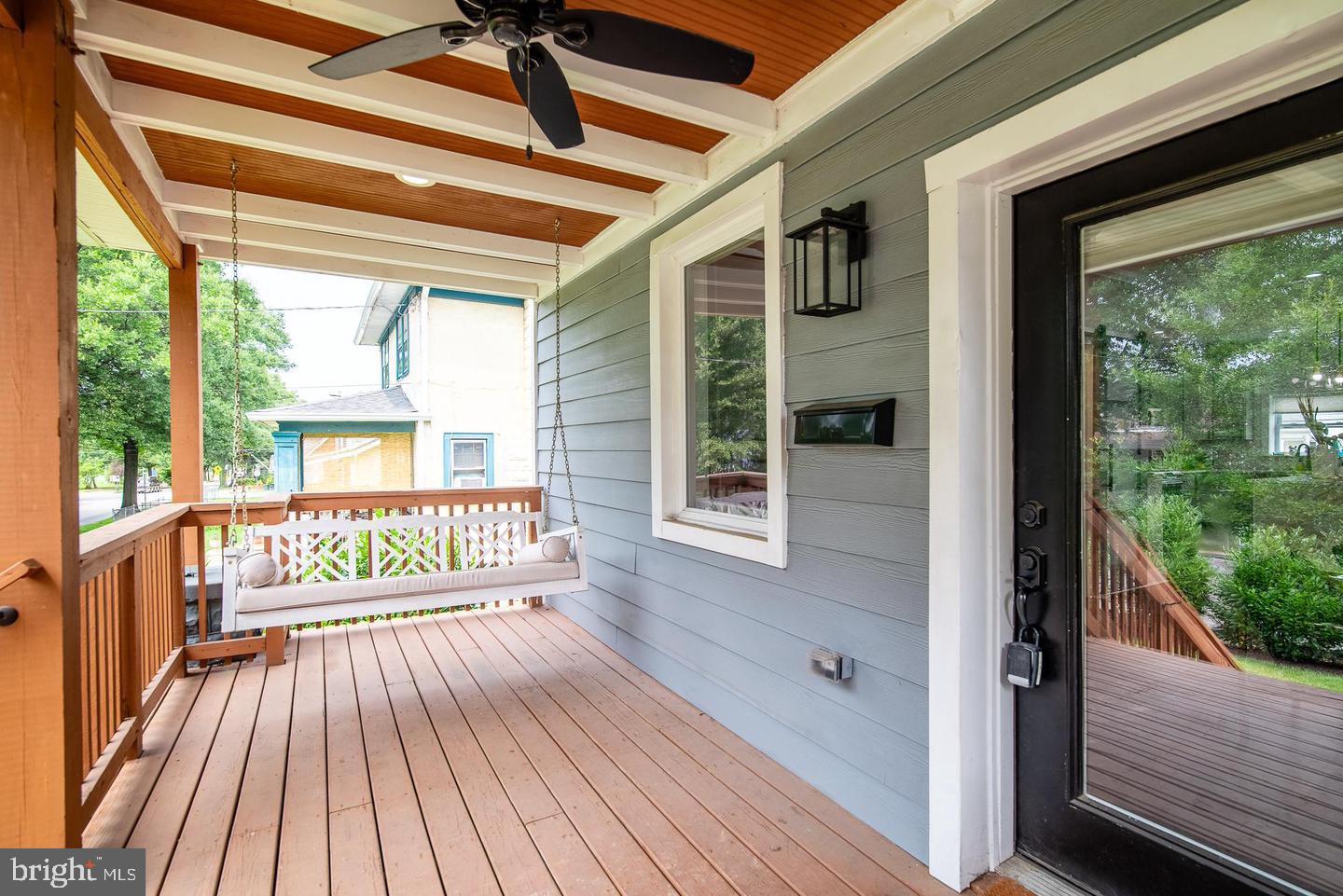 a view of porch with a bench in balcony