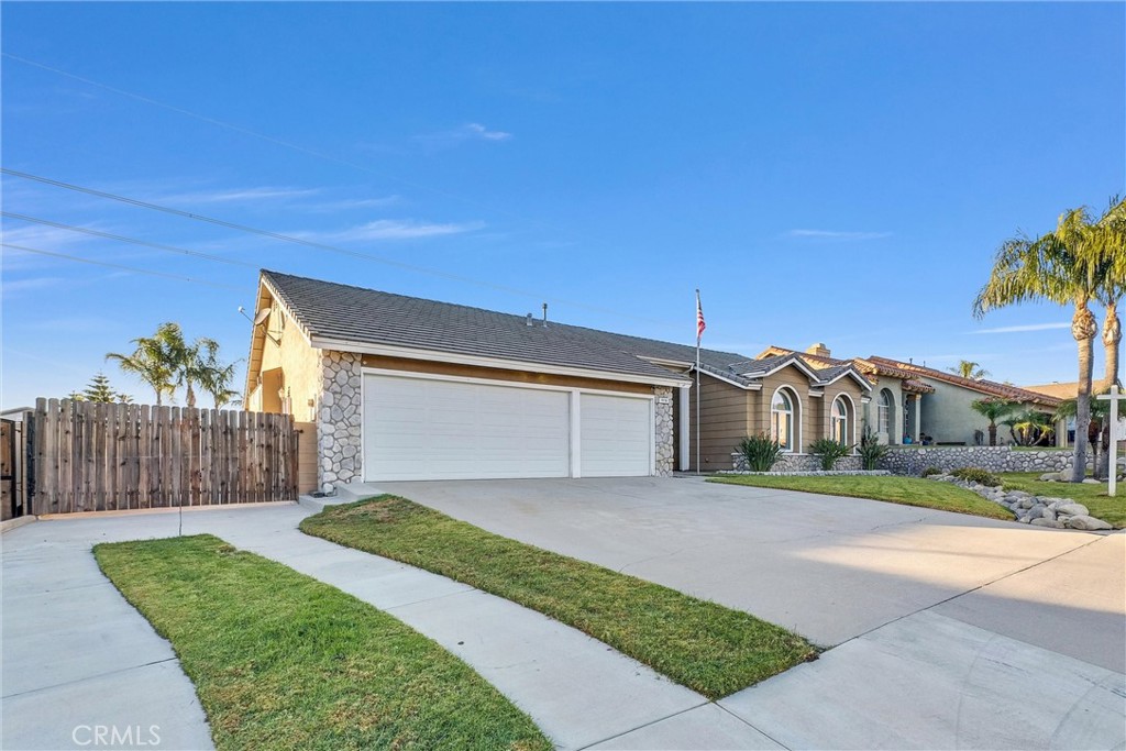 a front view of a house with a yard and outdoor seating